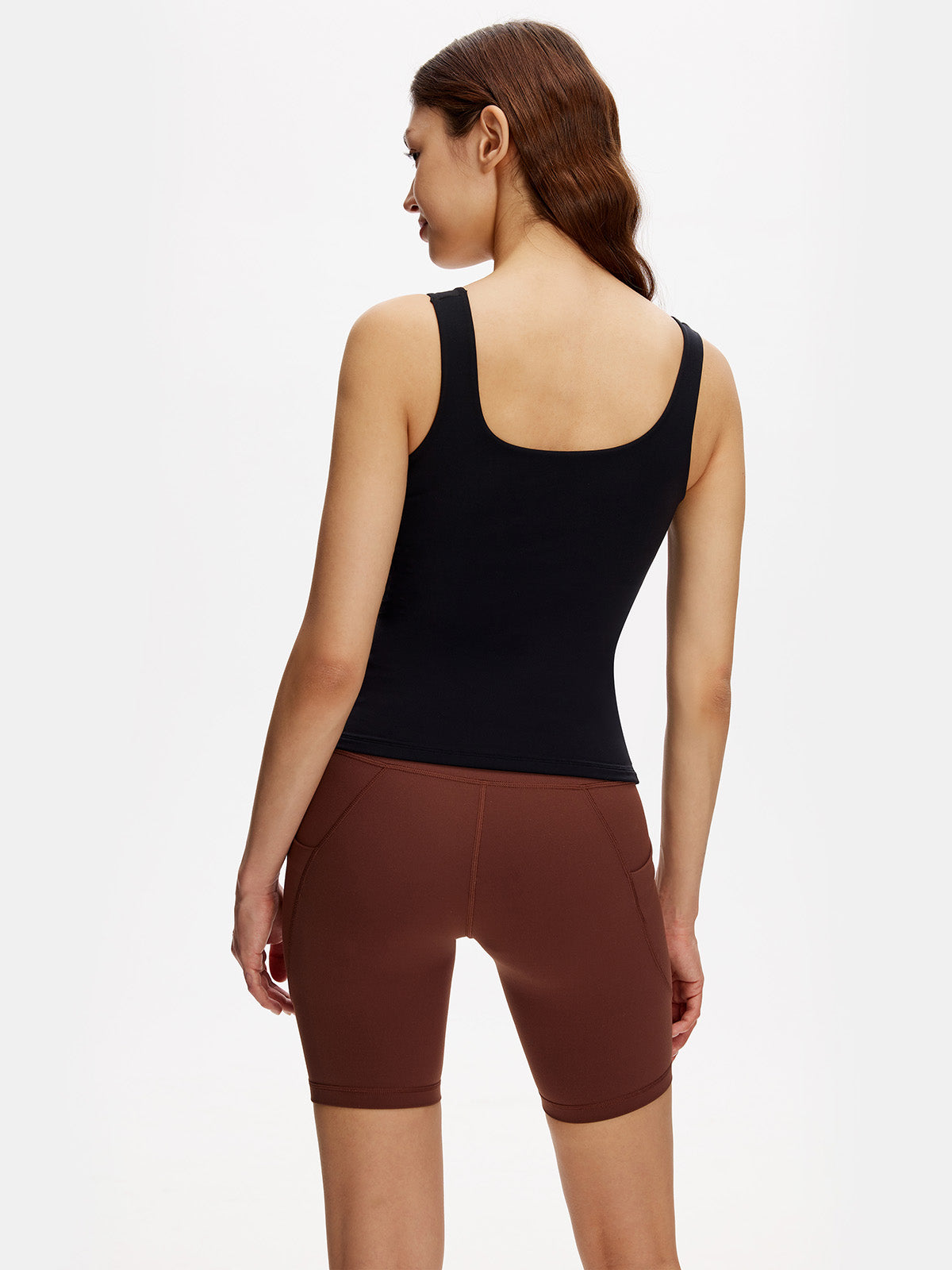 Back view of black slim fit tank – flattering shape-retaining fit with moisture-wicking performance.