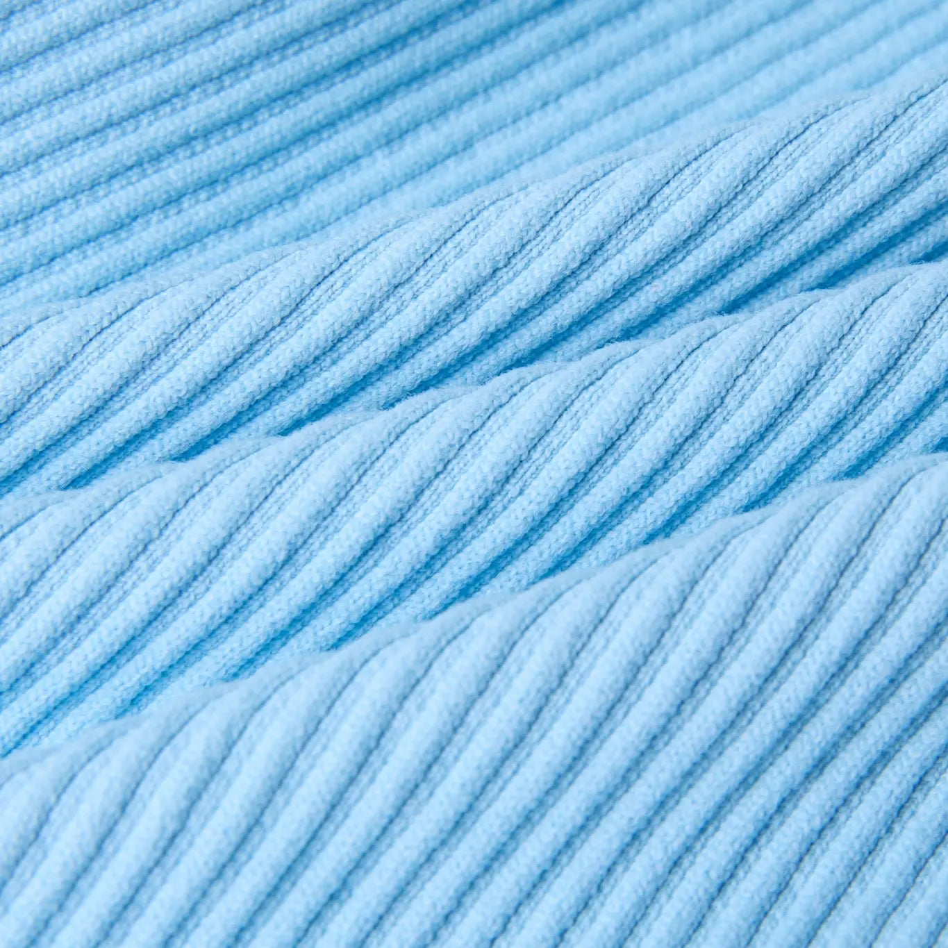 Close-up of light blue yarn with a textured surface