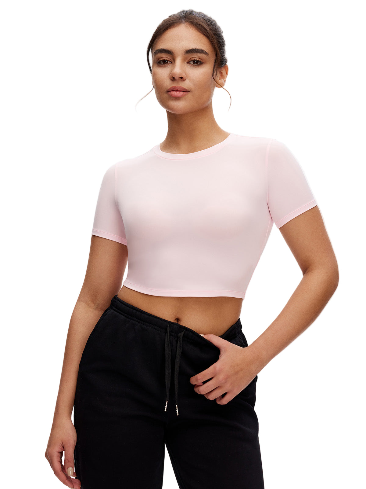 Back view of black cropped t shirt – fitted workout top with clean finish and soft stretch fabric