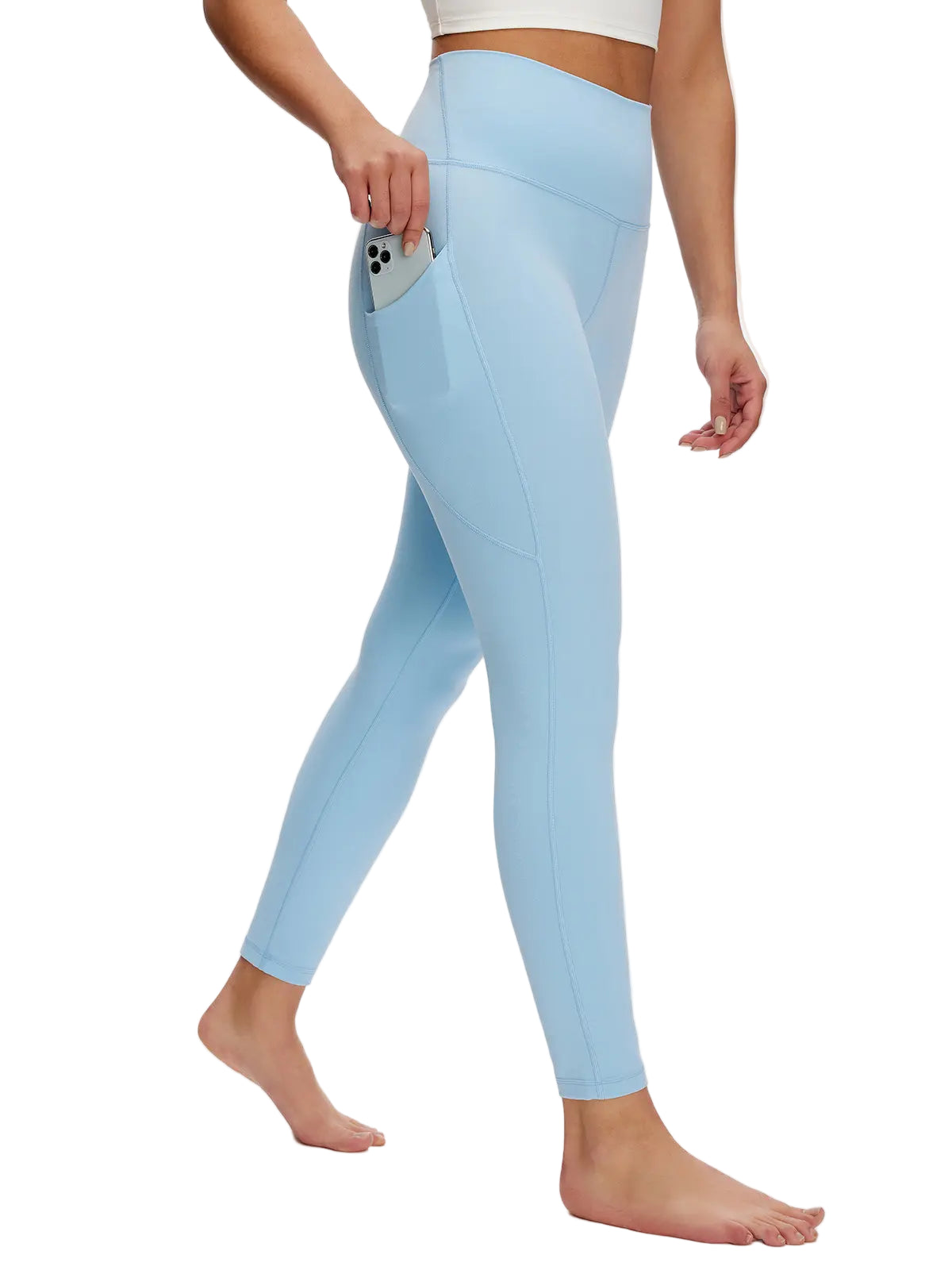 Light blue leggings worn by a person on a white background