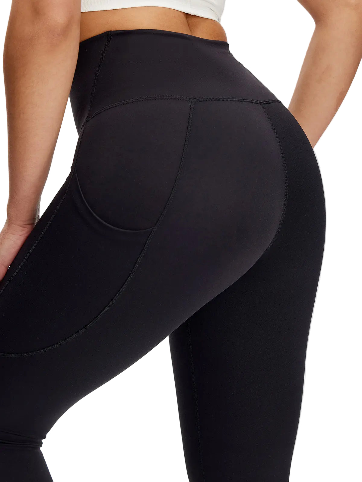 Black leggings worn by a person on a plain background