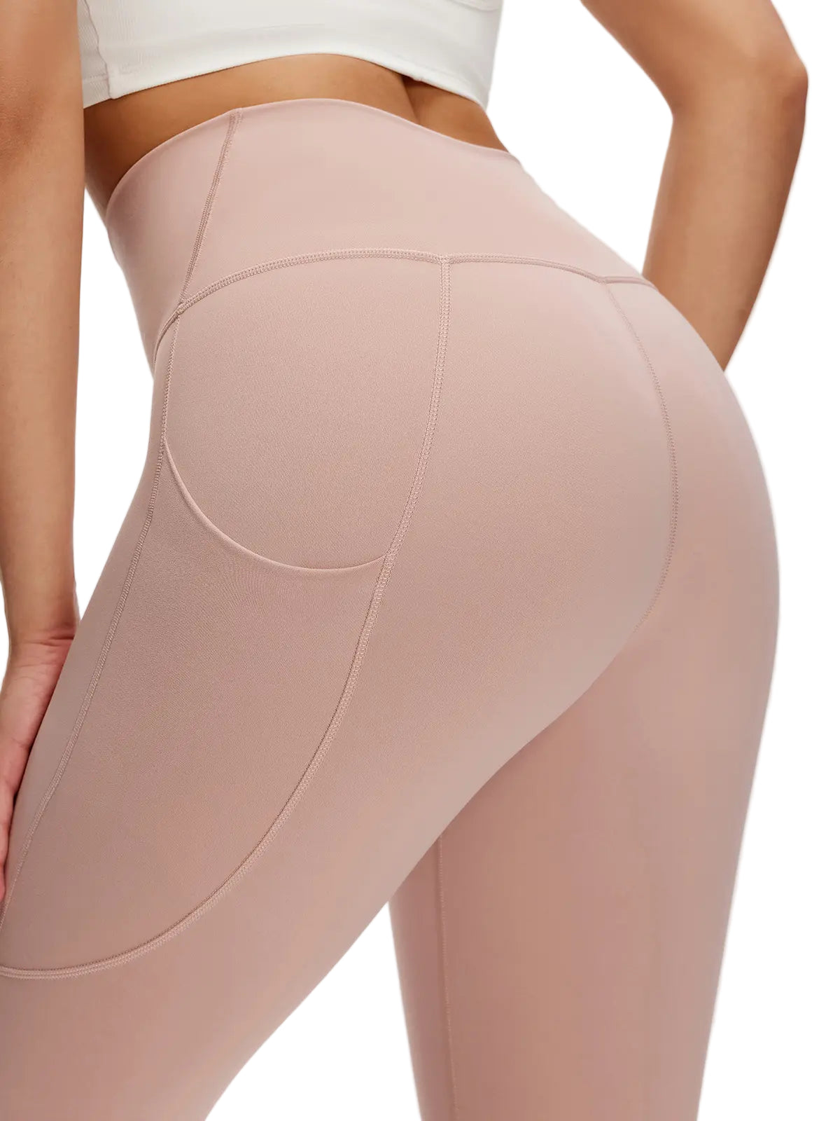 Beige leggings worn by a person on a white background