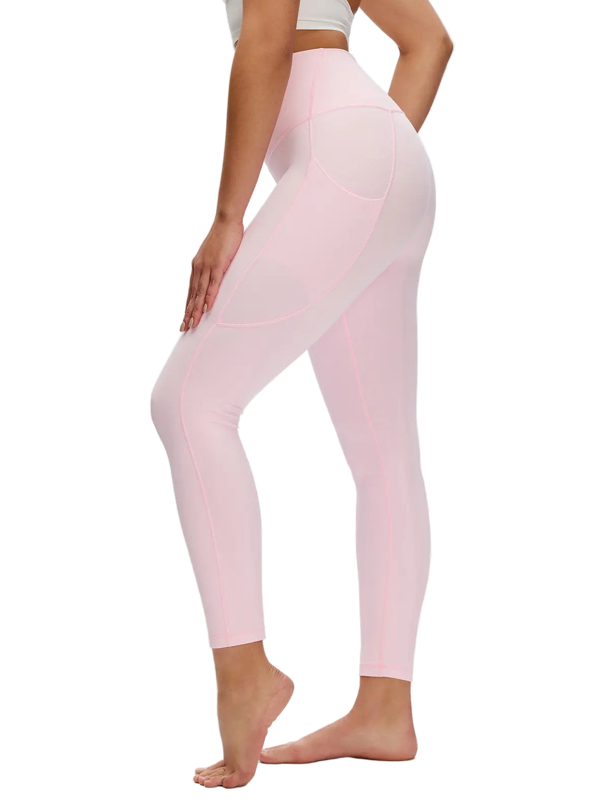 Person wearing light pink leggings on a white background