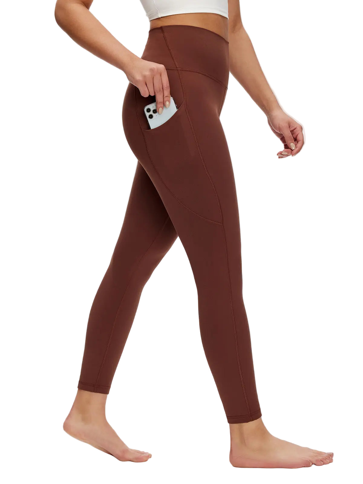 Brown leggings worn by a person on a white background