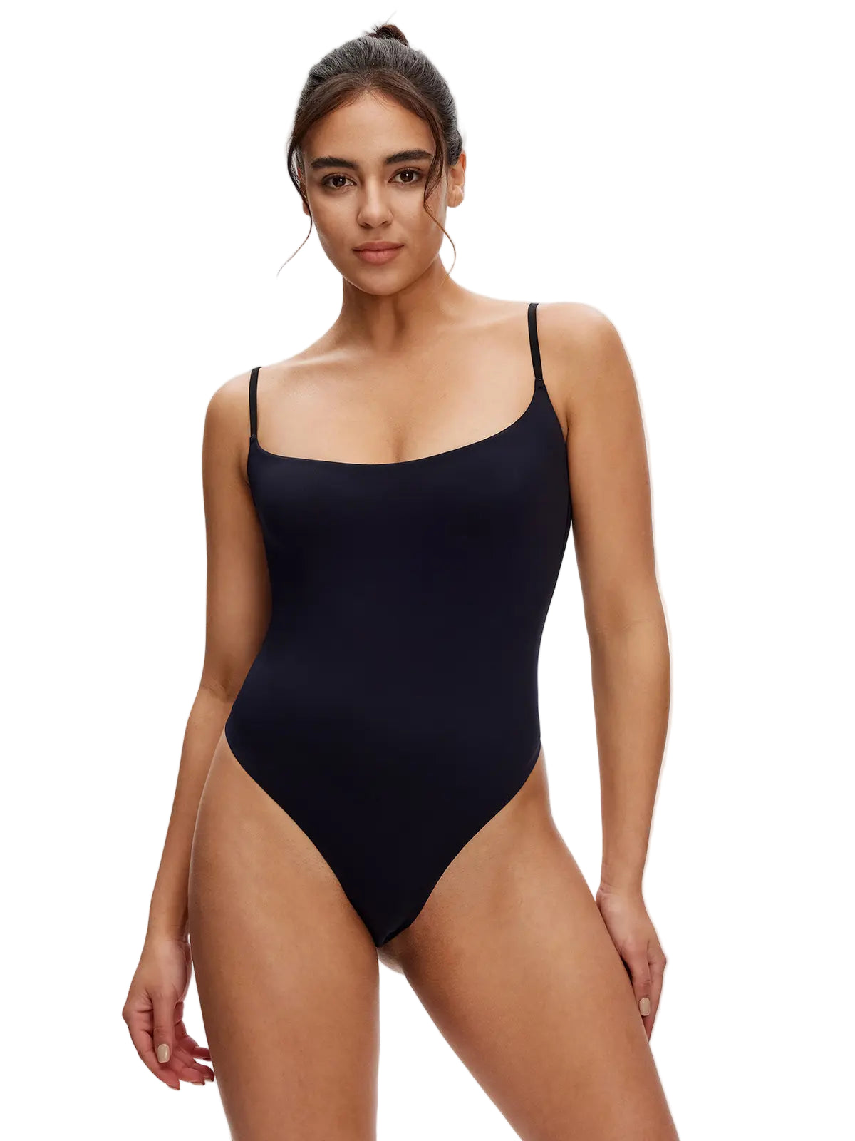 Woman wearing a black swimsuit against a white background