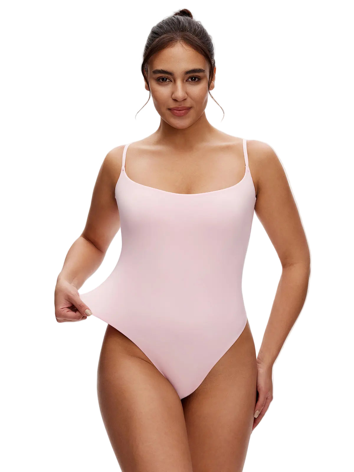 Woman wearing a light pink bodysuit on a white background