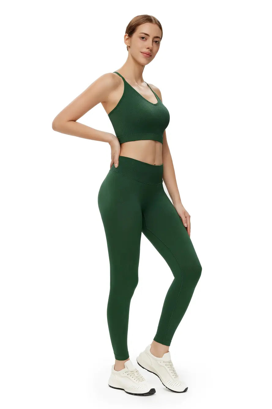 Woman wearing a green athletic outfit on a white background